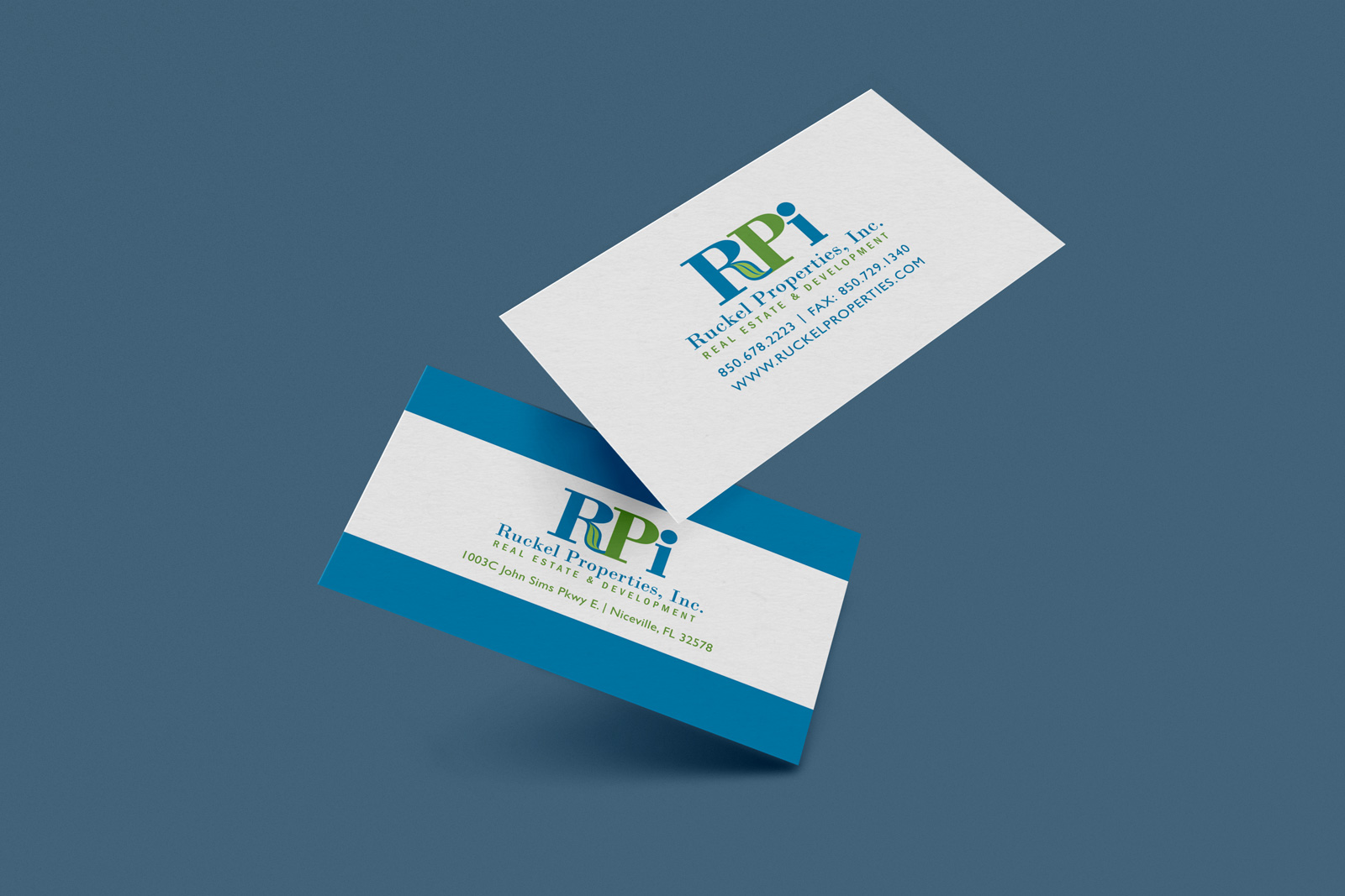 Blue and green designed business cards for real estate development company